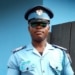 Testimonial from a man in blue police uniform with cap and sunglasses