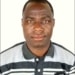 Man in striped polo shirt against white background