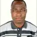 Man in striped polo shirt against white background