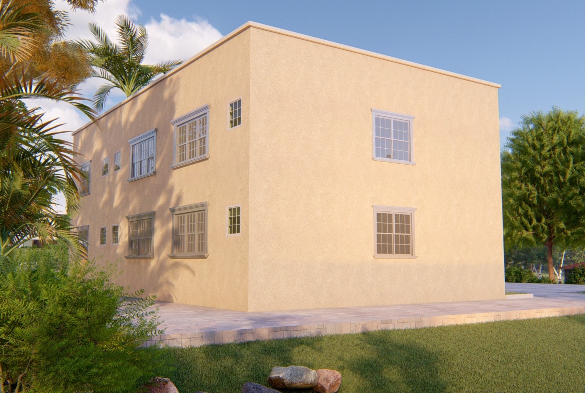 Small 1-bedroom apartment with stucco walls, surrounded by greenery